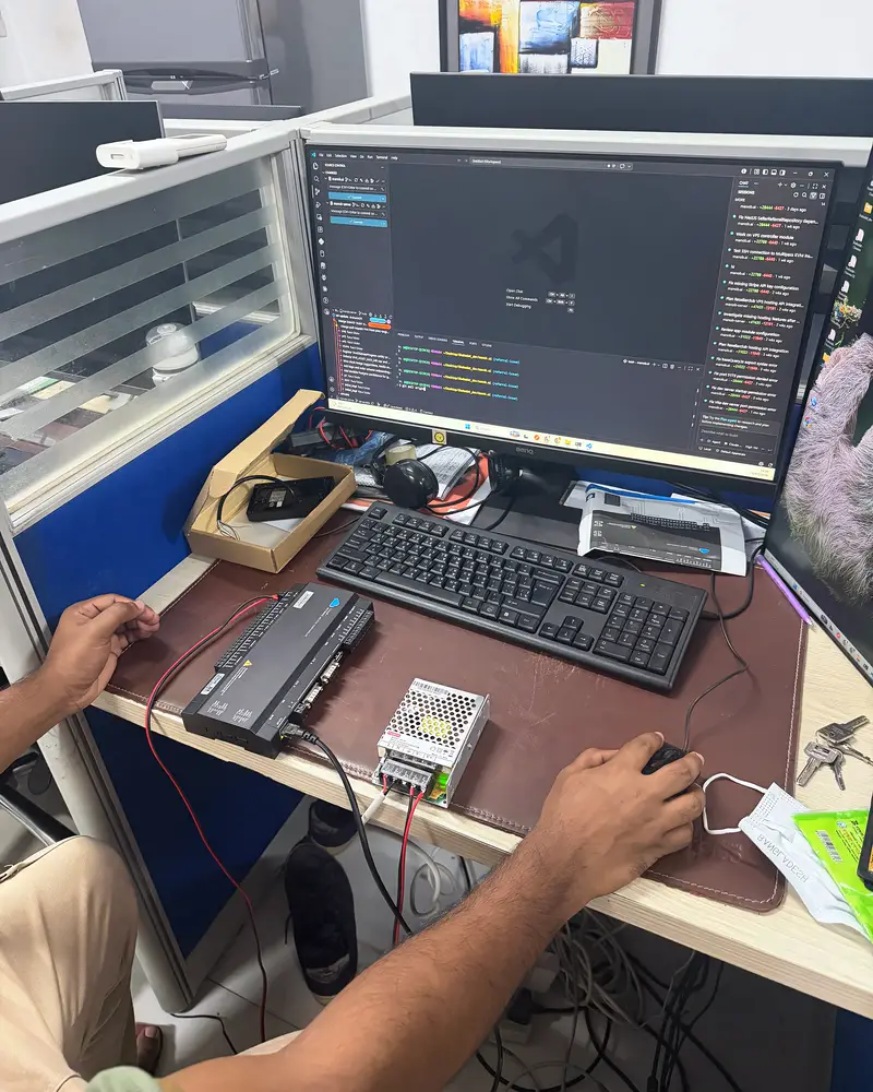 An Easital engineer working on the final version with the controller wired on the desk